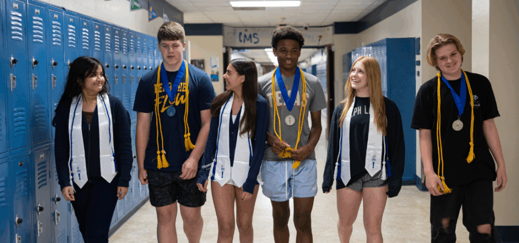 Group of NJHS students walking down a school hallway